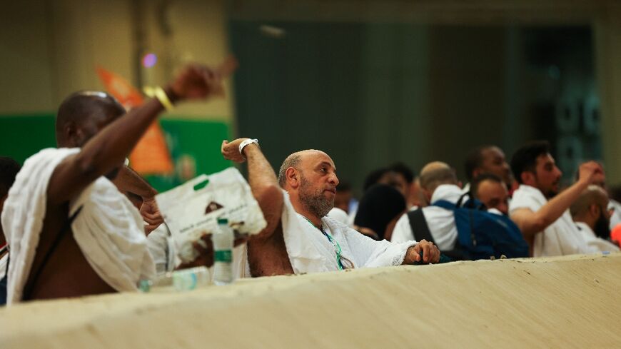 Muslim pilgrims perform the symbolic 'stoning of the devil' ritual as part of the hajj pilgrimage
