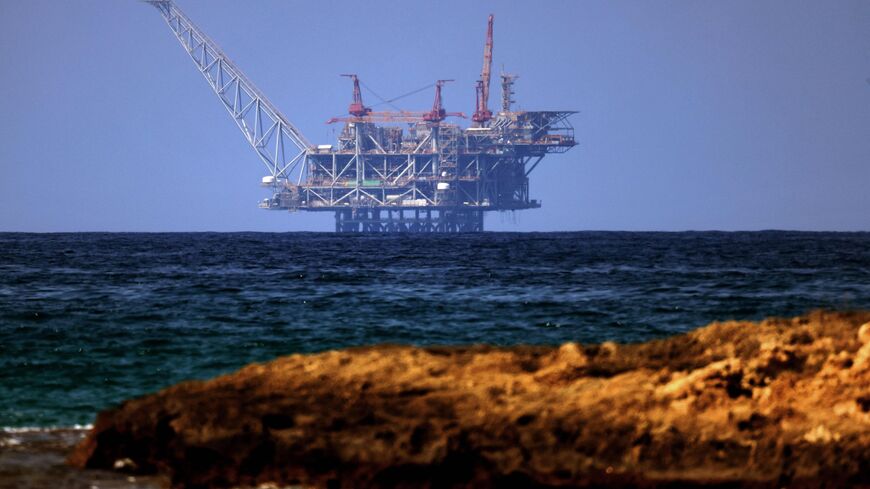 A view of the platform of the Leviathan natural gas field in the Mediterranean Sea is pictured from the Israeli northern coastal beach of Nasholim, on August 29, 2022.