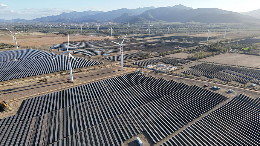 Wind turbines and solar pannels are seen on a campus near Cagliari on the island of Sardinia, Oct. 2, 2024.