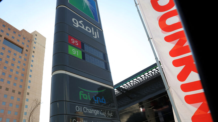 CORRECTION / A picture taken in Riyadh shows the sign in Arabic of an Aramco gas station on the outskirts of the Saudi capital Riyadh on November 5, 2024. Energy giant Saudi Aramco reported a 15 percent year-on-year drop in third quarter profit on November 5, 2024, citing low oil prices. (Photo by Fayez Nureldine / AFP) / "The erroneous mention[s] appearing in the metadata of this photo by Fayez Nureldine has been modified in AFP systems in the following manner: changing the second phrase to refer to Saudi 