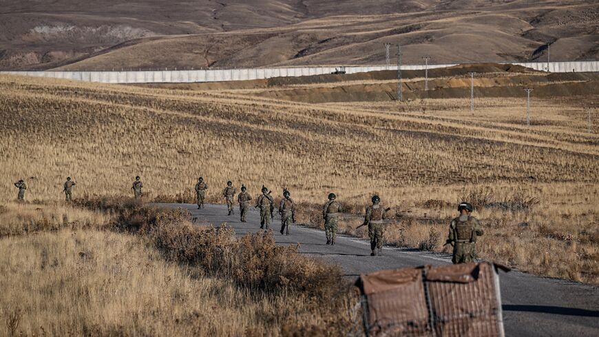 Turkish soldiers patrol near the border wall between Turkey and Iran in the Van Province, eastern Turkey, on Nov. 1, 2024.