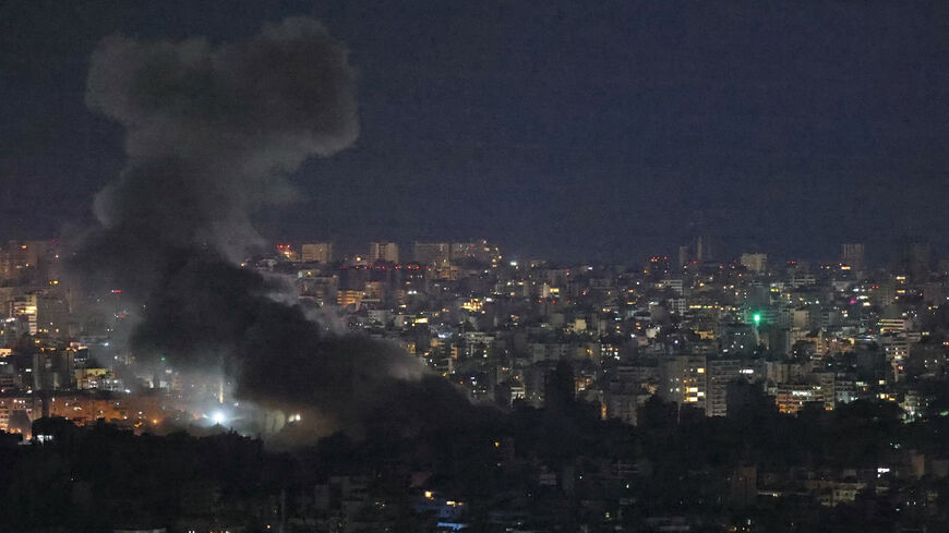 Smoke rises from the site of an Israeli air strike targeting the southern suburbs of Beirut, Nov. 23, 2024. 