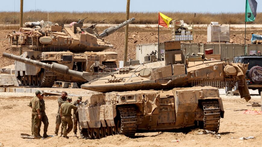 Israeli tanks are positioned along the border with the Gaza Strip, on June 5, 2025, amid the ongoing war between Israel and Hamas.
