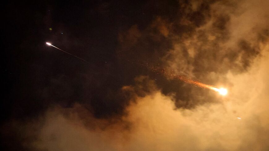 Rocket trails are seen in the sky above the Israeli coastal city of Netanya amid a fresh barrage of Iranian missile attacks on June 21, 2025. Israel's war with Iran entered its second week with the Israeli military chief warning of a "prolonged campaign" and Tehran ruling out further nuclear talks with the United States until Israel halts its attacks. (Photo by JACK GUEZ / AFP) (Photo by JACK GUEZ/AFP via Getty Images)