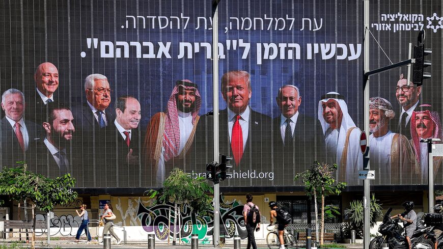 A billboard by the Coalition for Regional Security, with the Hebrew slogan which reads "A time for war, a time for settlement; now is the time for the 'Abrahamic Covenant,'" is displayed in Tel Aviv on June 26, 2025.