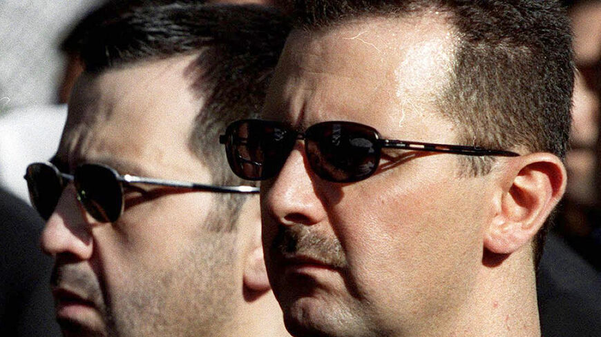 TO GO WITH STORY BY NATACHA YAZBECK (FILES) A picture dated June 13, 2003 shows Syrian President Bashar al-Assad and his brother Maher (L) attending their father's funeral in Damascus on June 13, 2000. As Bashar al-Assad's regime fights to stay in power, one man has emerged as the symbol of the dynasty's brutal military might -- the president's feared younger brother Maher. AFP PHOTO/RAMZI HAIDAR / AFP PHOTO / RAMZI HAIDAR (Photo credit should read RAMZI HAIDAR/AFP via Getty Images)