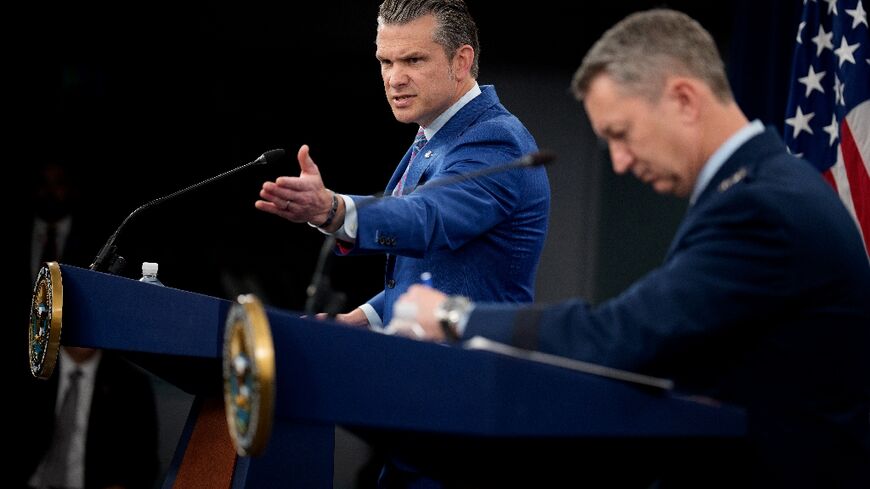 Defense Secretary Pete Hegseth (L) speaks alongside top US military officer General Dan Caine during a news conference at the Pentagon on June 26, 2025