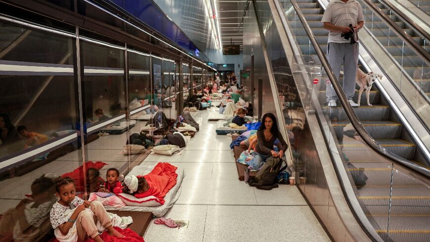 People take shelter in the Tel Aviv metro 