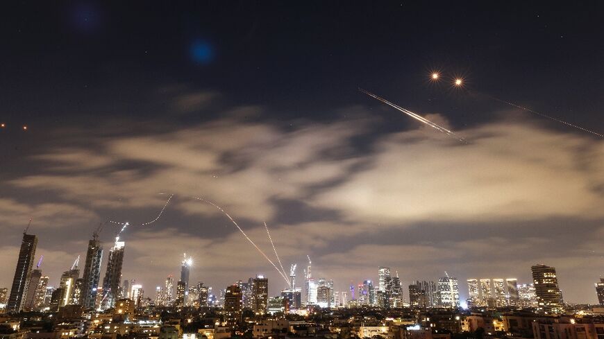 Israeli air defence systems work to intercept Iranian missiles over Tel Aviv on Sunday