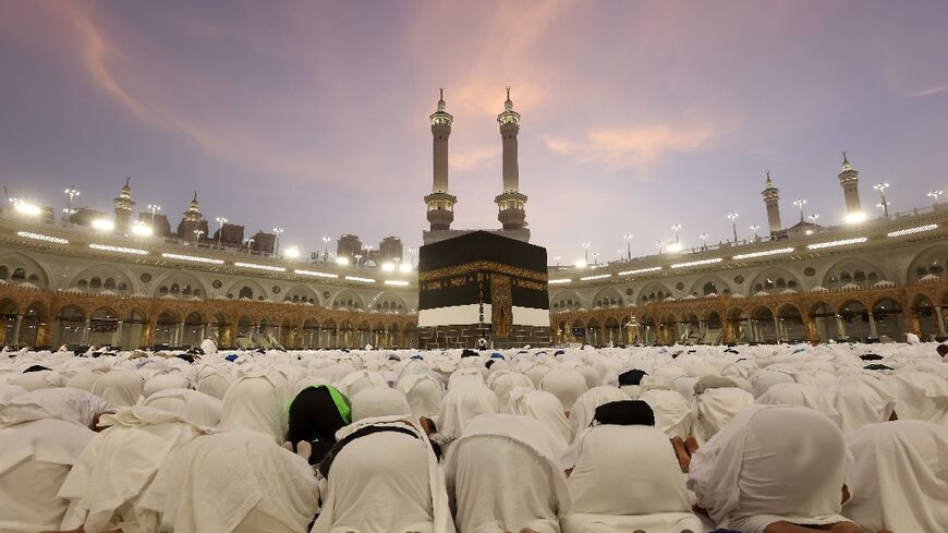 Muslim worshippers pray around the Kaaba, Islam's holiest shrine, at the Grand Mosque complex in the Saudi city of Mecca