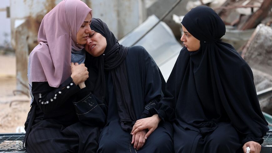 Mourners at a funeral of a Palestinian killed near an aid distribution centre in the Gaza Strip