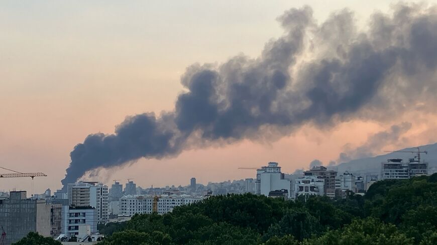 Smoke billows from an explosion at the Islamic Republic of Iran Broadcasting (IRIB) building in Tehran on June 16, 2025
