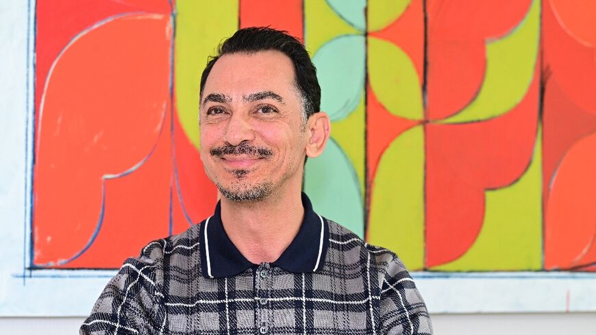 Rami Al Ali poses for a picture in his studio in Dubai on July 1, 2025. 