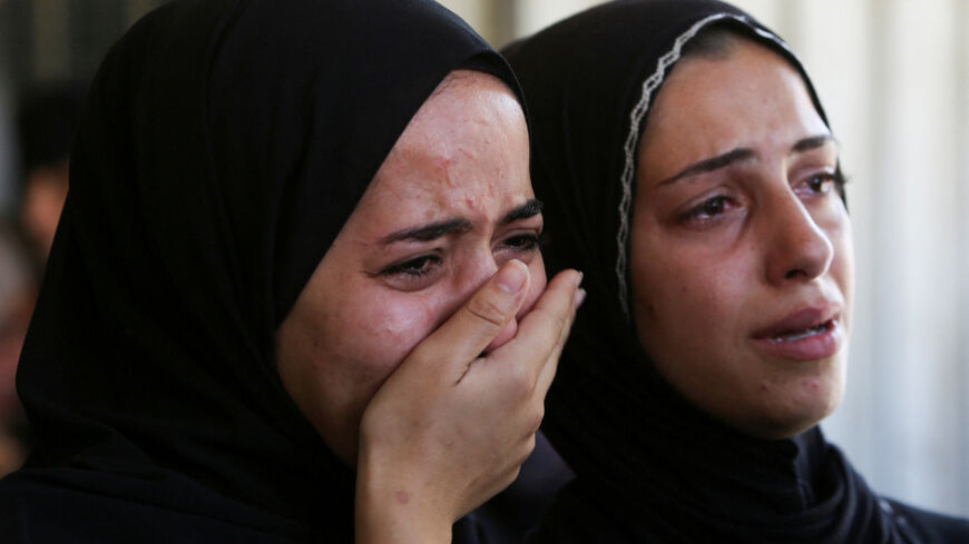 People mourn Palestinians who were killed in an incident on Wednesday while seeking aid in Khan Younis, at Nasser hospital in Khan Younis in the southern Gaza Strip July 16, 2025. REUTERS/Hatem Khaled