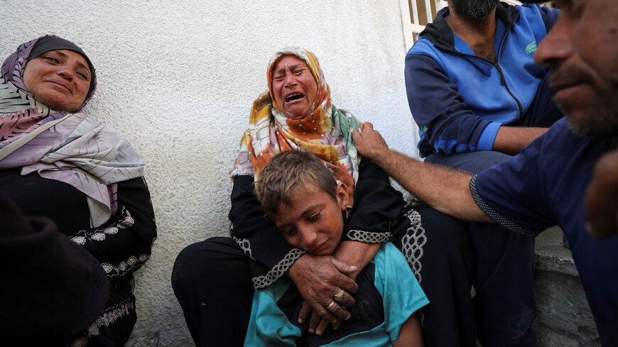 Mourners react during the funeral of Palestinians killed in overnight Israeli strikes, according to medics, at Al-Shifa hospital in Gaza City, July 17, 2025. REUTERS/Mahmoud Issa