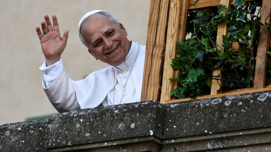 FILE PHOTO: Pope Leo XIV waves as he arrives at Castel Gandolfo, a hill town on the shores of Lake Albano, where he will be spending two weeks of vacation, in Castel Gandolfo, Italy, July 6, 2025. REUTERS/Vincenzo Livieri/File Photo