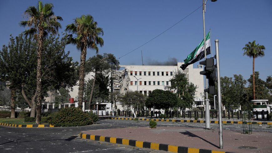 FILE PHOTO: Smoke rises above the building, after powerful airstrikes shook Damascus on Wednesday, targeting the defense ministry, as Israel vowed to destroy Syrian government forces attacking Druze communities in southern Syria and demanded their withdrawal, in Damascus July 16, 2025. REUTERS/Khalil Ashawi/File Photo