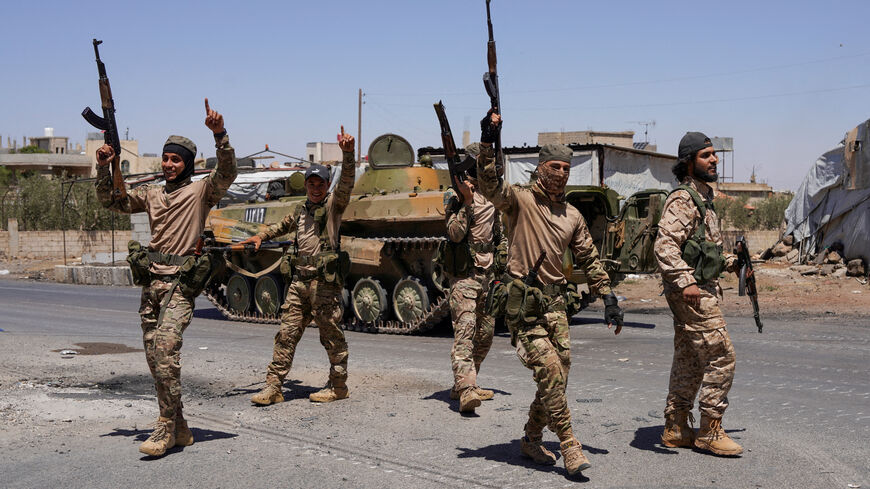 FILE PHOTO: Syrian security forces walk together along a street, after clashes between Syrian government troops and local Druze fighters resumed in the southern Druze city of Sweida early on Wednesday, collapsing a ceasefire announced just hours earlier that aimed to put an end to days of deadly sectarian bloodshed, in Sweida, Syria July 16, 2025. REUTERS/Karam al-Masri/File Photo