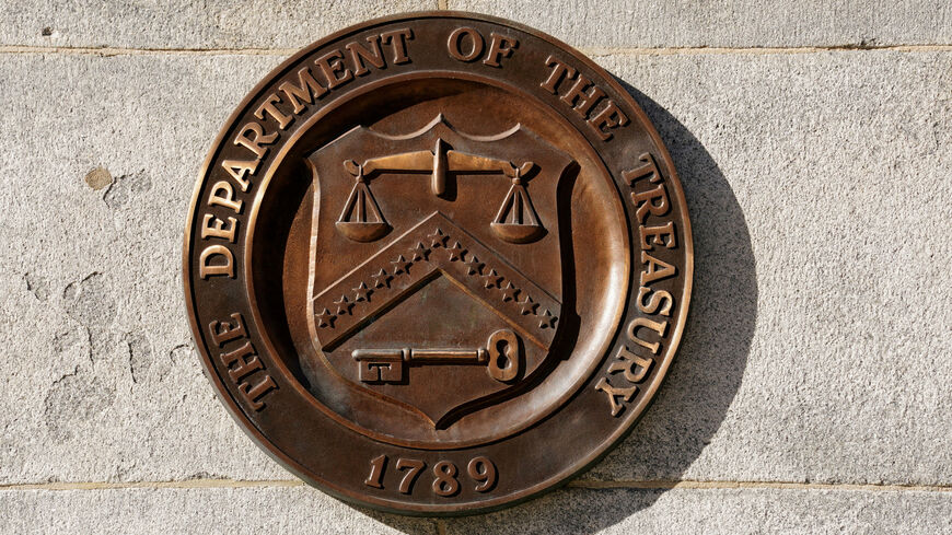 FILE PHOTO: A bronze seal for the Department of the Treasury is shown at the U.S. Treasury building in Washington, U.S., January 20, 2023. REUTERS/Kevin Lamarque/File Photo