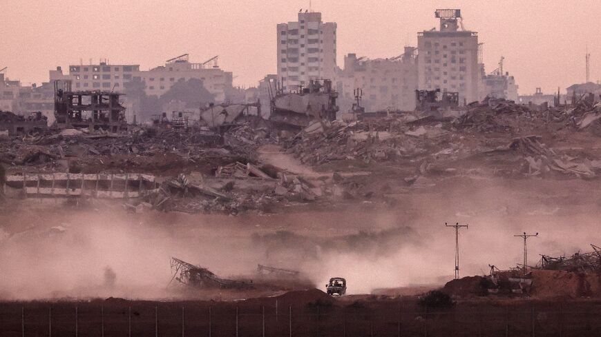 An Israeli military vehicle returning from the Gaza Strip into Israel
