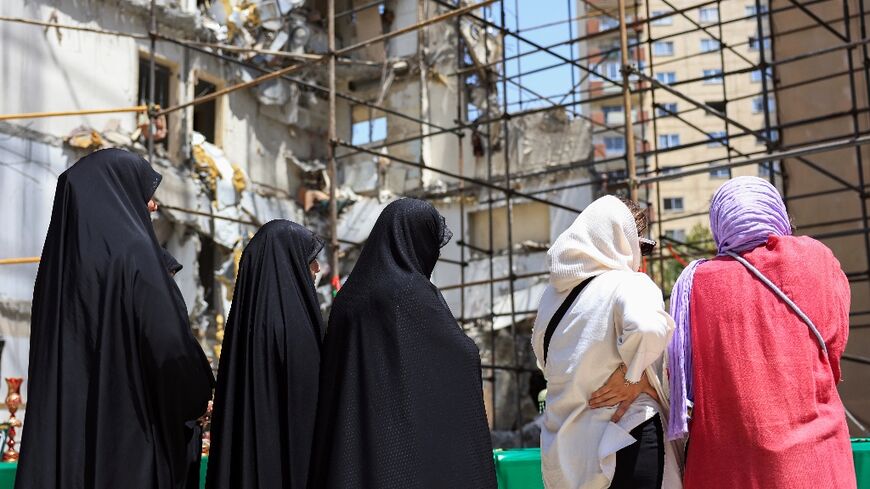 Israel struck major Iranian cities including Tehran, hitting military sites, government buildings and some residential areas