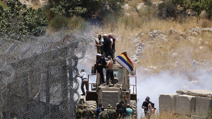 Israeli troops used teargas to control crowds amassed at the border with Syria in the Israeli-occupied Golan Heights