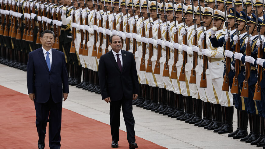 BEIJING, CHINA - MAY 29: Chinese President Xi Jinping walks next to Egyptian President Abdel Fattah al-Sisi (C) review the honour guard during a welcome ceremony for Egyptian President Abdel Fattah al-Sisi at the Great Hall of the People on May 29, 2024 in Beijing, China. (Photo by Tingshu Wang-Pool/Getty Images)