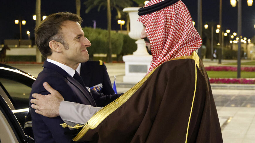 TOPSHOT - French President Emmanuel Macron is welcomed by Saudi's Crown Prince Mohammed Bin Salman ahead of their meeting in Riyadh on December 2, 2024. Macron touched down in Riyadh, the capital of the oil-rich Gulf kingdom, where he was due to hold talks with de facto ruler Crown Prince Mohammed bin Salman later on December 2, an AFP journalist said. (Photo by Ludovic MARIN / POOL / AFP) (Photo by LUDOVIC MARIN/POOL/AFP via Getty Images)