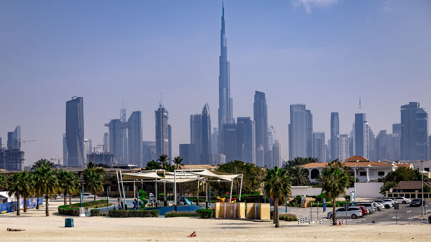 Burj Khalifa, the world's tallest building, adorns the Dubai skyline as people sunbathe on Jumerah beach, Dubai, United Arab Emirates, Jan. 30, 2025.