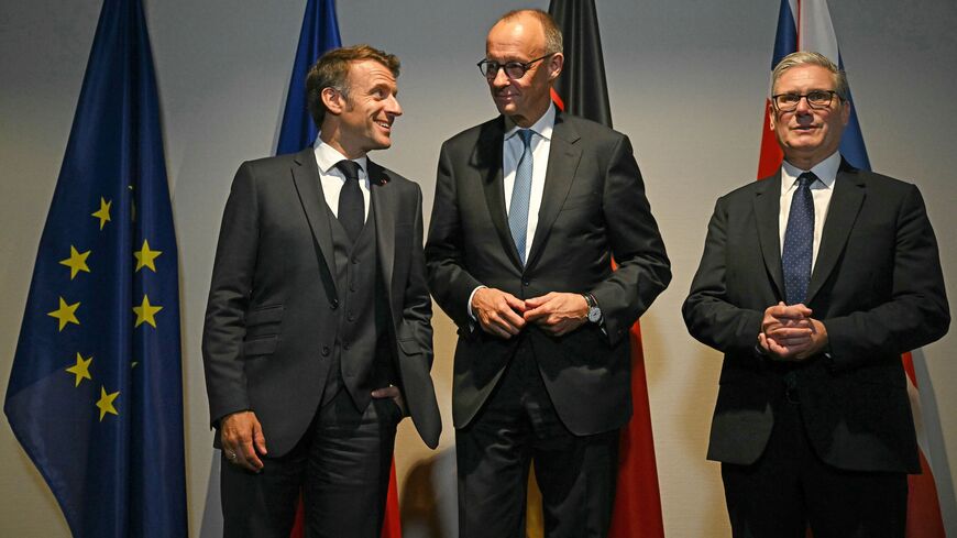 French President Emmanuel Macron, German Chancellor Friedrich Merz and British Prime Minister Keir Starmer pose for the media at a hotel prior to an E3 meeting on the sidelines of the 2025 NATO summit on June 24, 2025, in The Hague, Netherlands. 