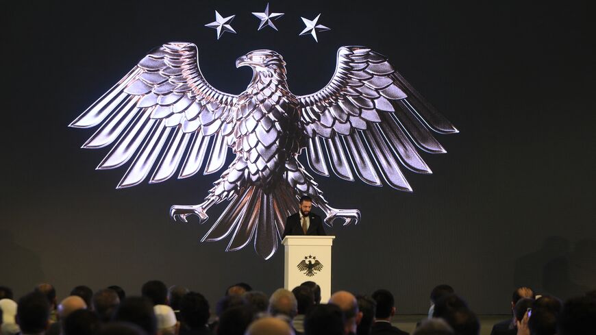 Syrian President Ahmad Al-Sharaa delivers a speech at the presidential palace during the unveiling of the country's new national emblem, Damascus, July 3, 2025. 