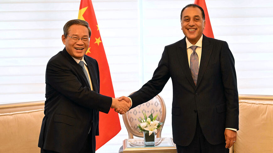 Egypt's Prime Minister Mostafa Madbouly (R) meets with China's Premier Li Qiang at his office in Cairo on July 10, 2025.