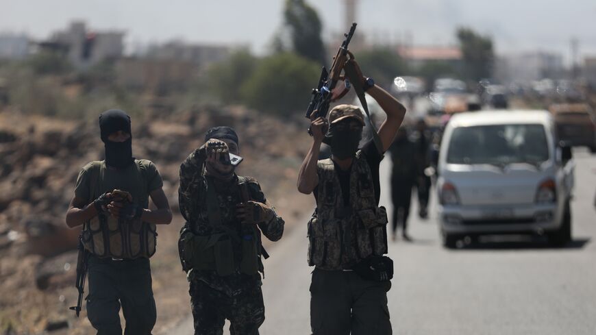Bedouin fighters are seen on the streets of al-Mazraa village in Syria's southern Suwayda governorate on July 18, 2025, in Suwayda, Syria.