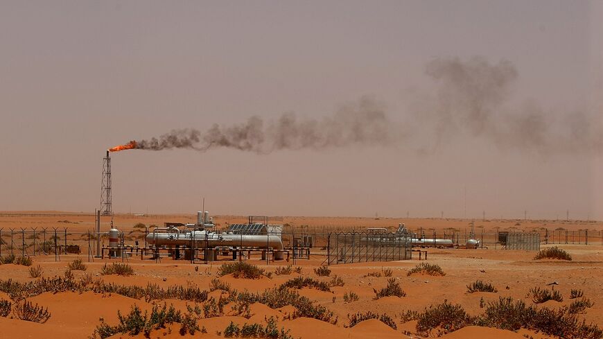 A flame from a Saudi Aramco oil instillation known as "Pump 3" is seen in the desert near the oil-rich area of Khouris, 160 kilometers east of the Saudi capital Riyadh, on June 23, 2008.