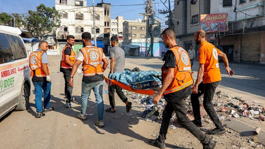 Palestinian rescuers carried a victim of an Israeli strike in Gaza City
