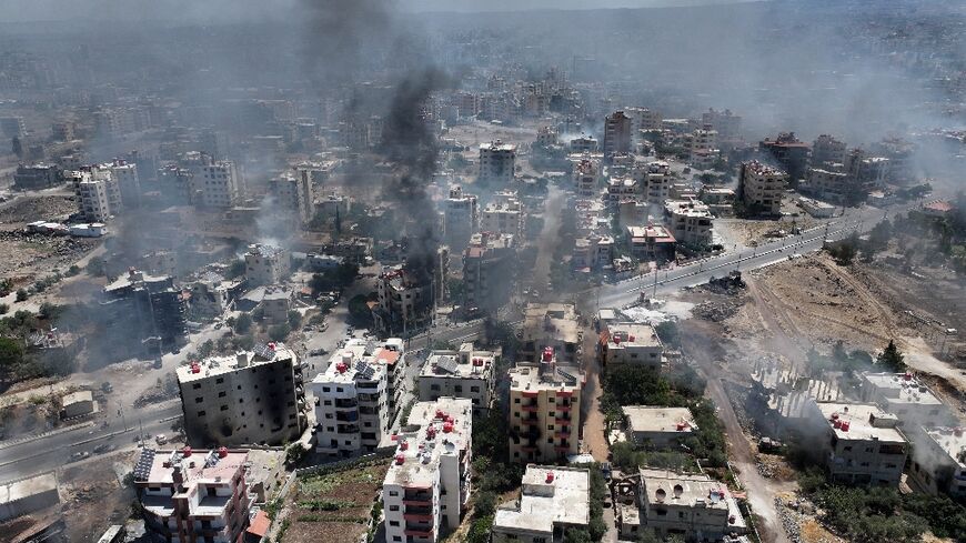 Smoke rises over the Syrian city of Sweida as AFP correspondents report gunfire and explosions in several neighbourhoods despite a ceasefire ordered by the Islamist-led government.