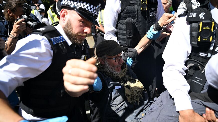 Police moved in on a small group of protesters displaying signs supporting Palestine Action