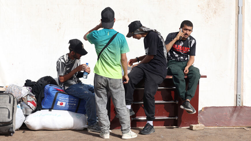 Afghan nationals, who were deported from Iran, rest with their belongings at a camp set up for returning migrants near the Islam Qala border crossing in Herat province, Afghanistan, July 23, 2025. REUTERS/Sayed Hassib