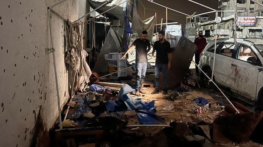 Palestinians inspect the site of an Israeli strike where Al Jazeera says its journalists Anas Al Sharif, Mohammed Qreiqeh and three photojournalists were killed, in Gaza City, August 11, 2025. REUTERS/Ebrahim Hajjaj