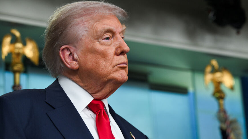 U.S. President Donald Trump looks on as he speaks to the press about deploying federal law enforcement agents in Washington to bolster the local police presence, in the Press Briefing Room at the White House, in Washington D.C., U.S., August 11, 2025. REUTERS/Annabelle Gordon