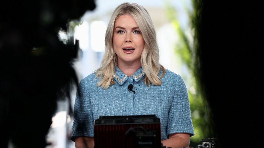 FILE PHOTO: White House Press Secretary Karoline Leavitt speaks before a TV news camera at the White House in Washington, D.C., U.S., August 14, 2025. REUTERS/Kevin Lamarque/File photo