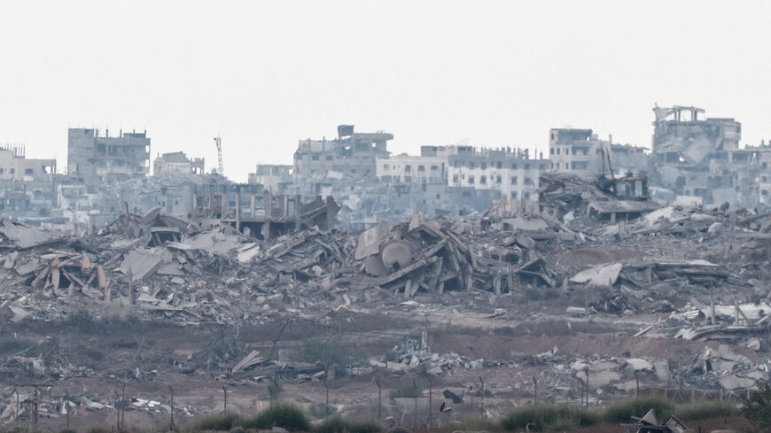 FILE PHOTO: A view of destroyed buildings in Gaza, as seen from the Israeli side of the border between Gaza and Israel, August 19, 2025. REUTERS/Amir Cohen/File Photo