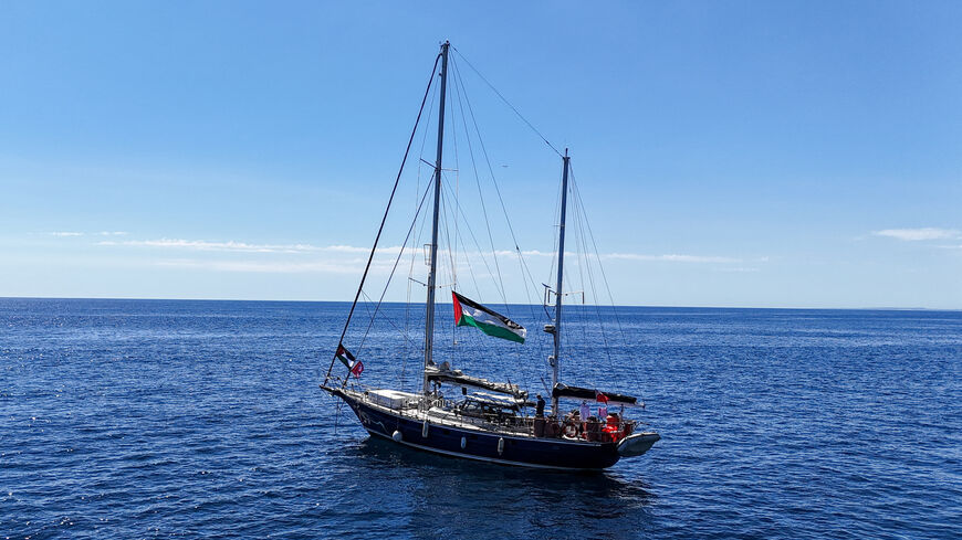 FILE PHOTO: A drone view shows the Gaza-bound aid ship Madleen, organized by the international NGO Freedom Flotilla Coalition, anchored off the coast of Catania, Italy, on June 1, 2025. REUTERS/Danilo Arnone/File Photo