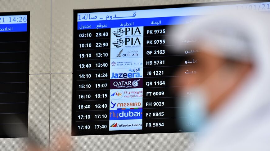 People wait for the arrival of relatives at King Khalid International Airport in the Saudi capital of Riyadh on the first commercial flight from Qatar on Jan. 11, 2021.