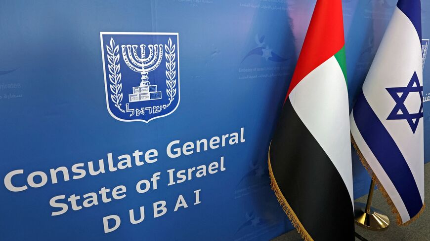 The national flags of the United Arab Emirates (L) and Israel are set side by side at the new Israeli consulate of Dubai ahead of a press conference by Israel's foreign minister on June 30, 2021.