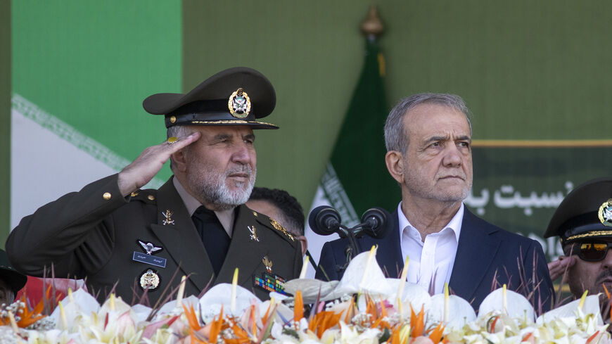 Iranian President Masoud Pezeshkian (R) makes a speech as he attends the National Army Day ceremony on April 18, 2025 in Tehran, Iran.