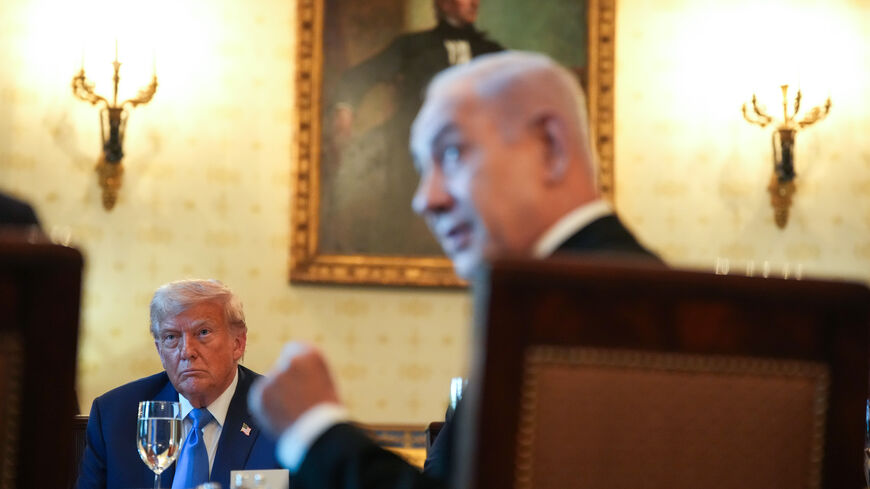 WASHINGTON, DC - JULY 07: U.S. President Donald Trump looks on as Israeli Prime Minister Benjamin Netanyahu speaks during a dinner in the Blue Room of the White House on July 07, 2025 in Washington, DC. Trump is hosting Netanyahu for a dinner as the two discuss a potential ceasefire agreement to end the fighting in Gaza. (Photo by Andrew Harnik/Getty Images)
