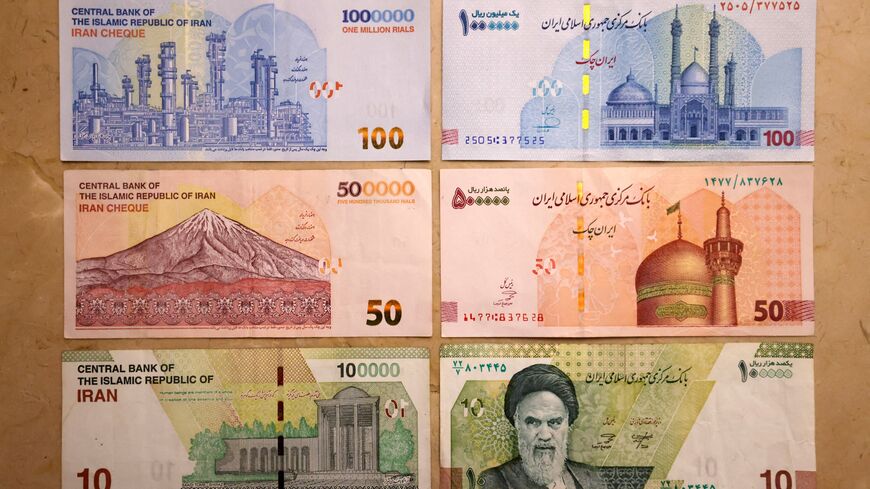 This picture shows old Iranian banknotes of 1 million, 500,000,and 100,000 rials (L), and the new banknotes with four zeros removed (R), on Aug. 3, 2025.
