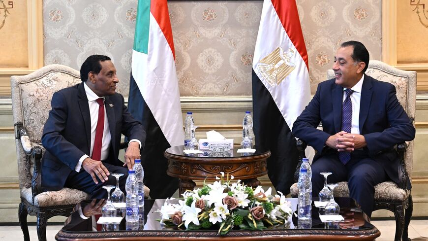 Egypt's prime minister, Mostafa Madbouly (R), meets with his counterpart from Sudan, Kamil Idris, upon his arrival in Egypt's capital, Cairo, on Aug. 7, 2025.