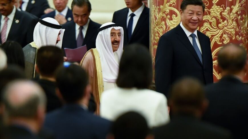 China's President Xi Jinping (R) and Kuwaiti ruling Emir Sheikh Sabah al-Ahmad al-Jaber al-Sabah (C) arrive for the 8th Ministerial Meeting of China-Arab States Cooperation Forum at the Great Hall of the People in Beijing on July, 10, 2018.